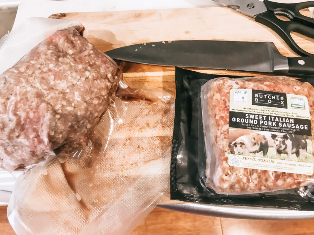 One package of ground pork and one package of ground beef on a cutting board